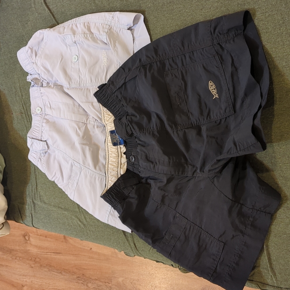 2 pair size 30 aftco short. Black and very light baby blue